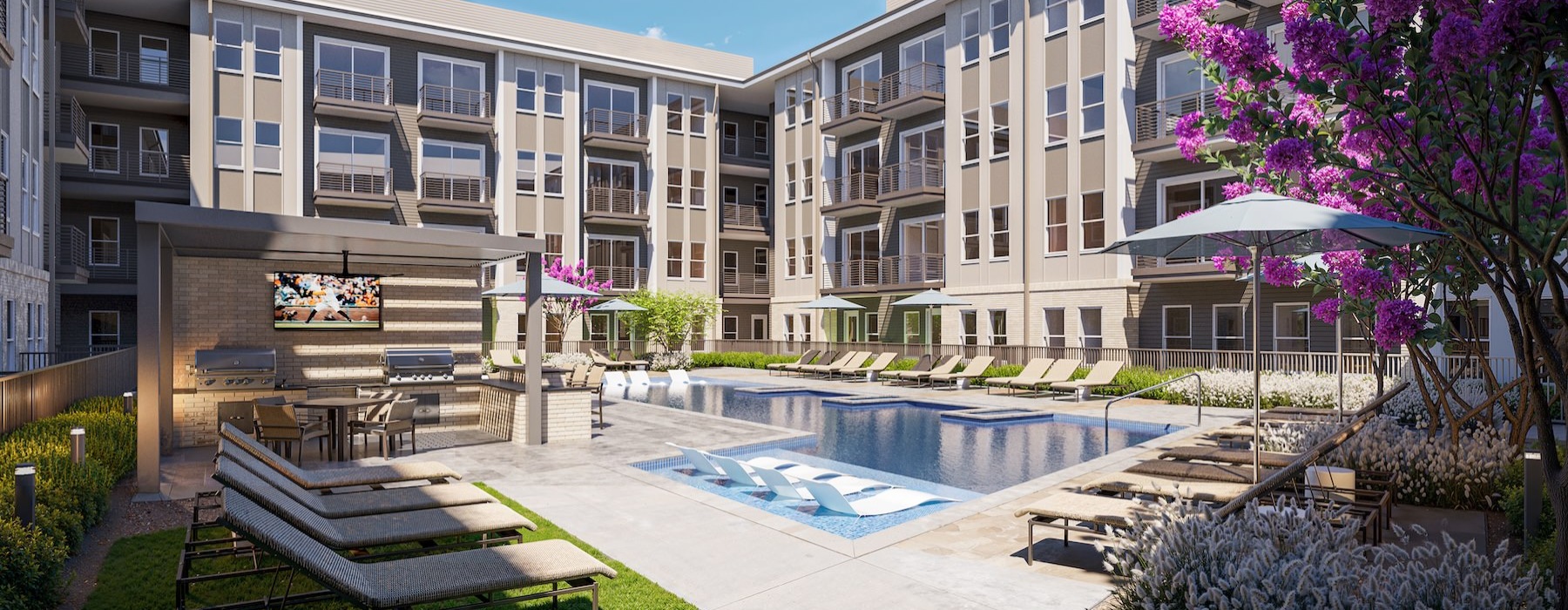 a courtyard with a pool and lounge chairs