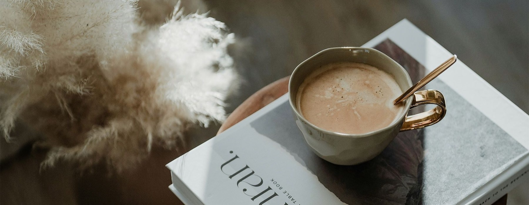 a cup of coffee on a book