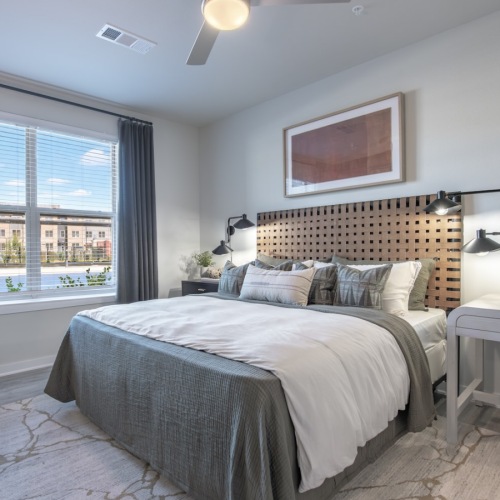 a bedroom with a bed and two nightstands